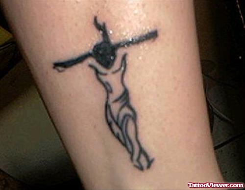 Black Ink Jesus Cross Tattoo On Leg