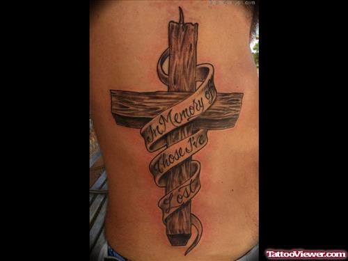 Grey Ink Cross With Banner Tattoo On Side Rib