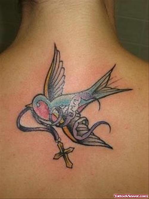 Colored Swallow Cross Tattoo On Upperback