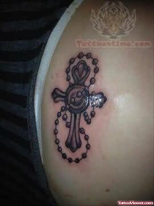 Awesome Tiny Rosary Cross Tattoo On Back Shoulder