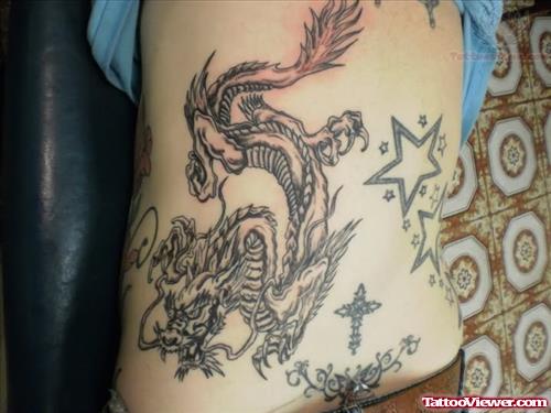 Dragon Star And Cross Tattoo On Back