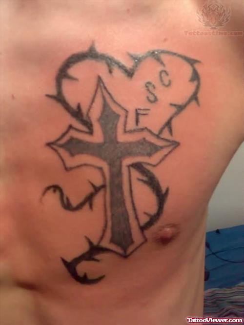 Heart And Cross Tattoo On Chest