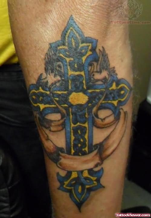 Blue ink Cross Tattoo On Arm