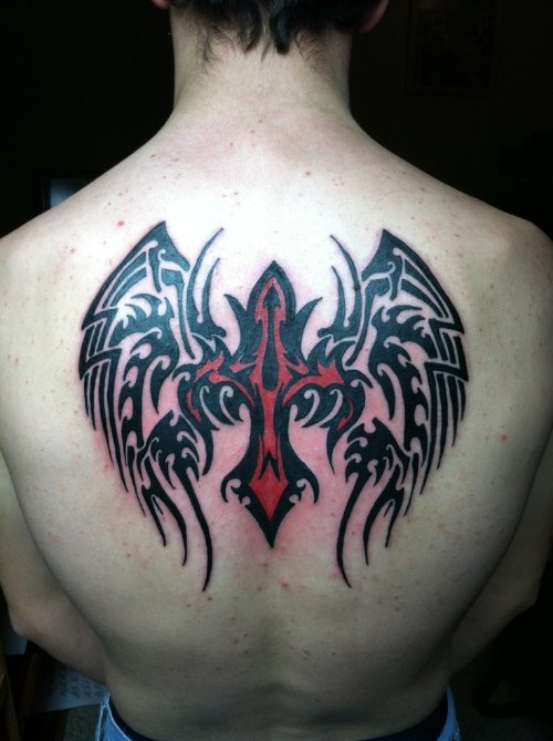 Red Cross And Tribal Winged Tattoo On Back