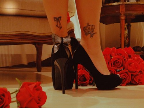 Grey Ink Bow And Crown Tattoos On Ankles