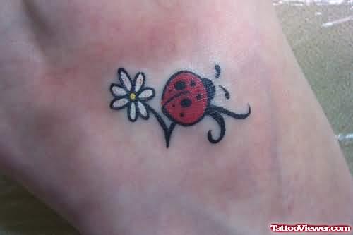 Daisy Flower And Bug Tattoo