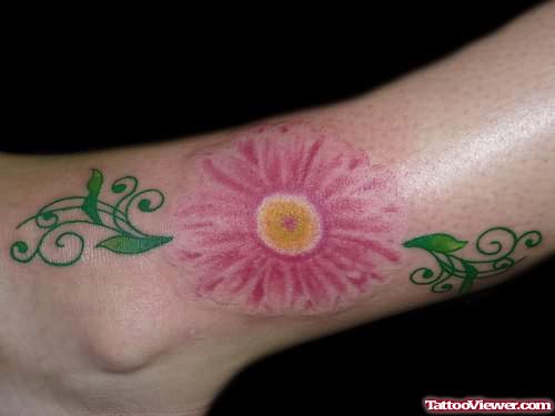 Pink Daisy Tattoo On Ankle
