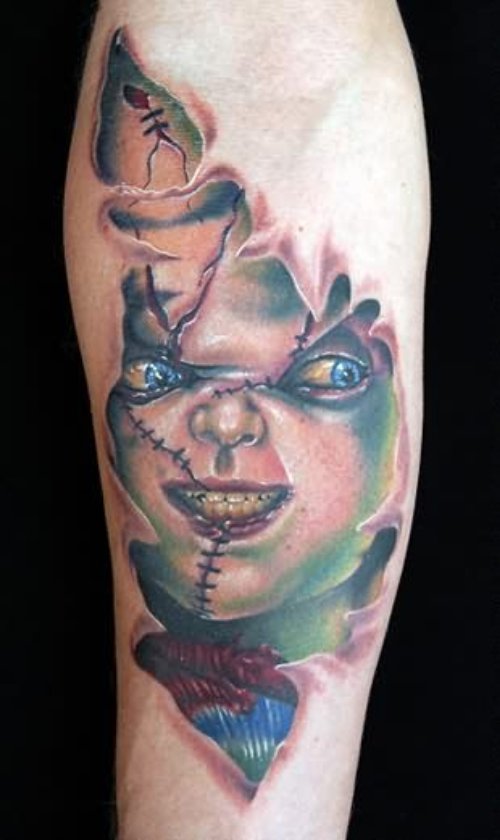 Chucky Skin Tattoo On Arm