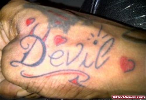 Tiny Red Hearts And Devil Tattoo On Right Hand