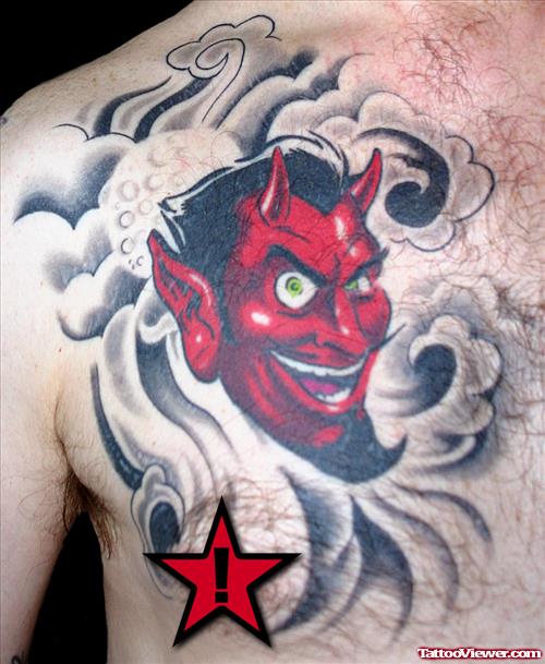 Red Ink Devil Head Tattoo On Man Chest
