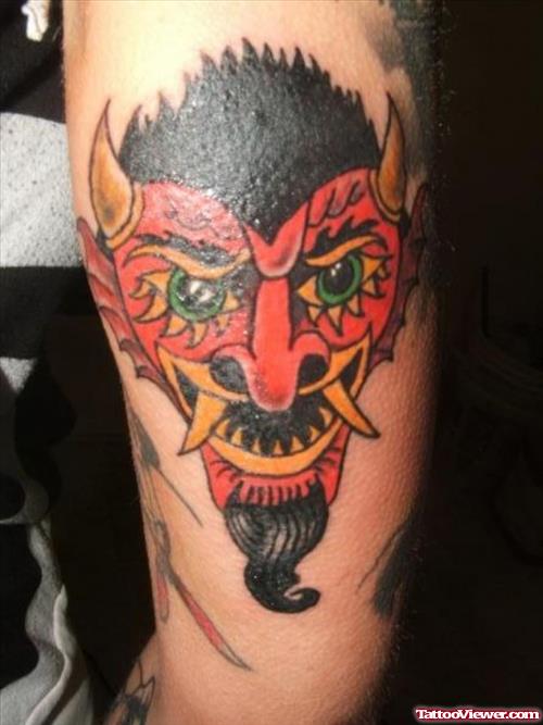 Red Ink Devil Head Tattoo On Bicep