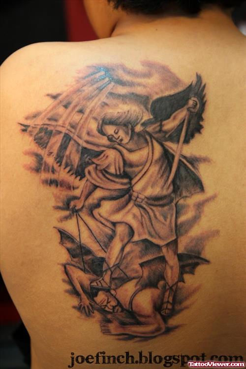 Grey Ink Archnagel And Devil Tattoo On Left Back Shoulder