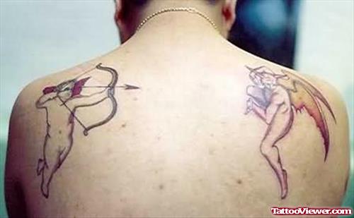 Awful Angel & Devil Fighting Tattoo On Back