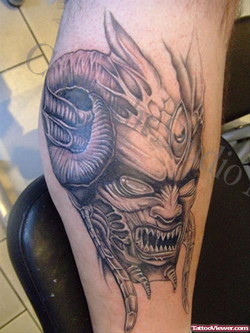 Grey Ink Devil Head Leg Tattoo