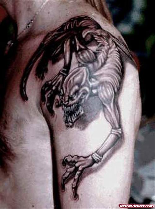 Grey Ink Devil Tattoo On Man Left Shoulder
