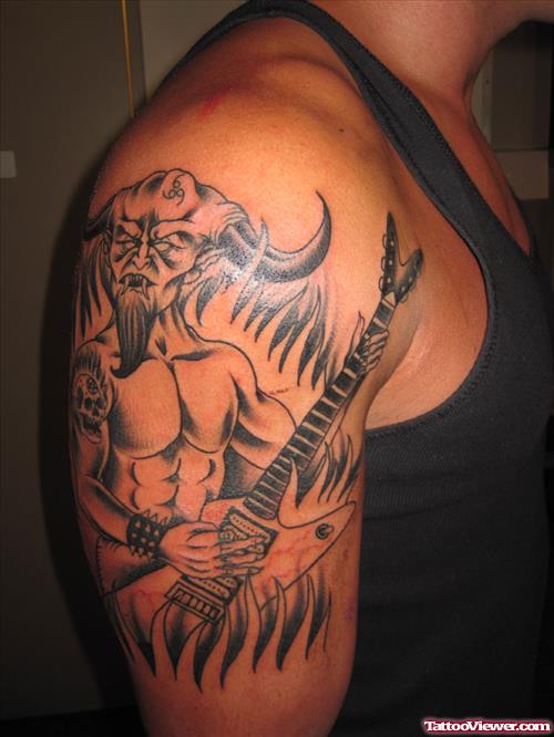 Devil With Guitar Tattoo On Shoulder