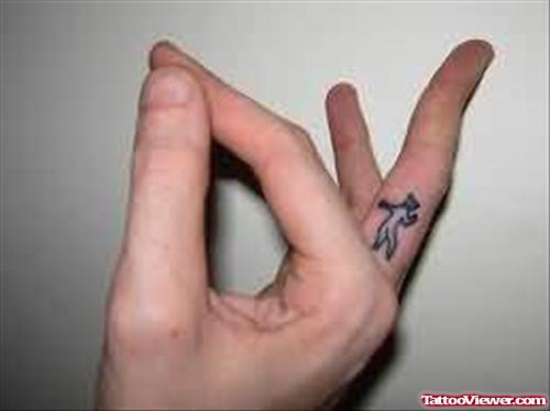 Tiny Devil Tattoo On Finger
