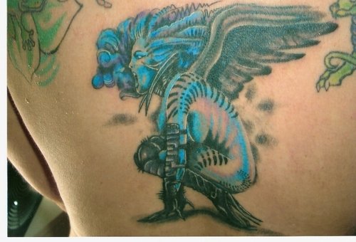 Blue Ink Devil Tattoo On Back