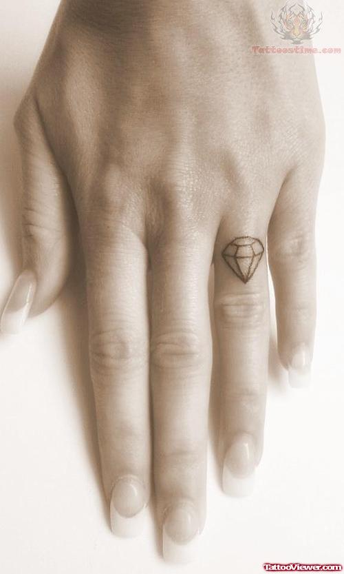 Tiny Diamond Tattoo On Finger