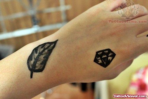 Black Leaf And Diamond Tattoo