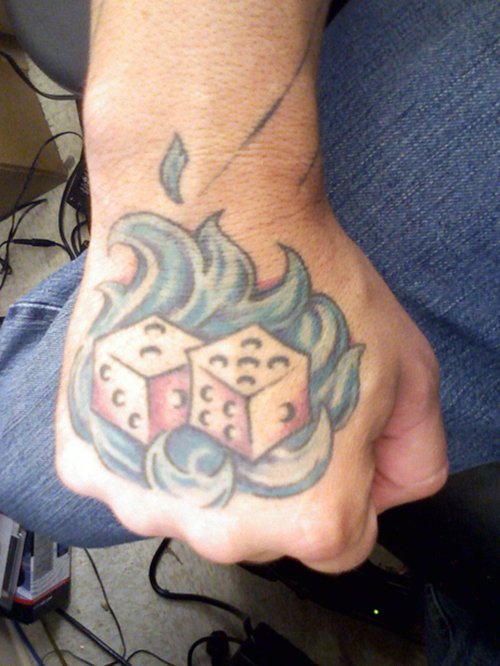 Dice In Waves Tattoo On Right Hand