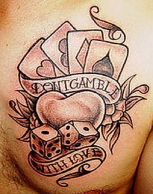 Banner And Dice Tattoo On Man Chest