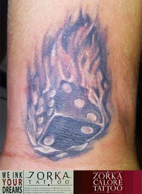 Grey Ink Flaming Dice Tattoo