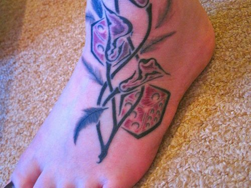 Flower And Dice Tattoos On Left Foot