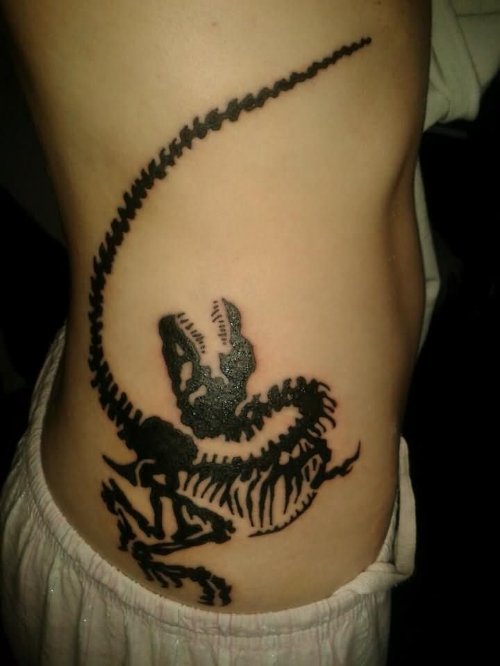 Black Ink Dinosaur Skeleton Tattoo On Side Rib