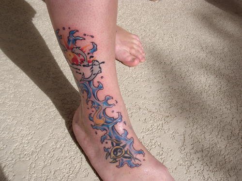 Tribal Dolphin Tattoo On Leg