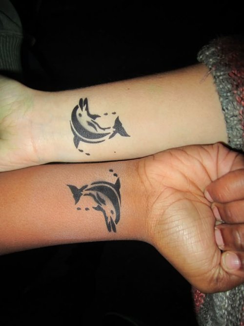 Black Tribal Dolphin Tattoos On Wrists