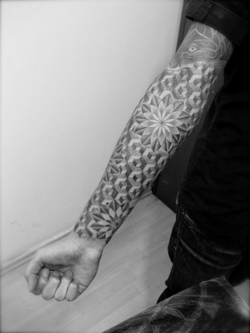 Guy Showing Dotwork Tattoo On Right Forearm