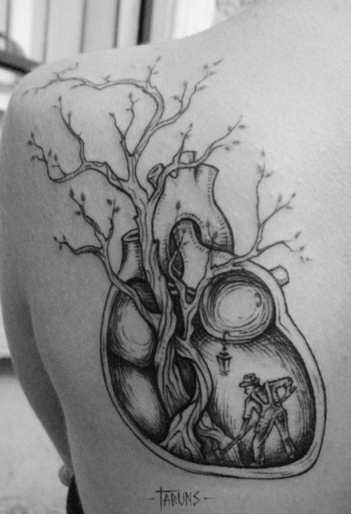 Grey Ink Himan Heart Dotwork Tattoo On Back Shoulder