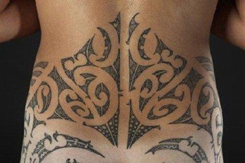 Tribal Dotwork Tattoo On Girl Lowerback