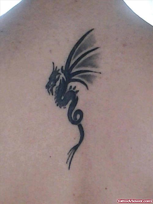 Amazing Black Ink Dragon Tattoo On Back