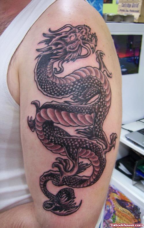 Grey Ink Dragon Tattoo On Left Half Sleeve