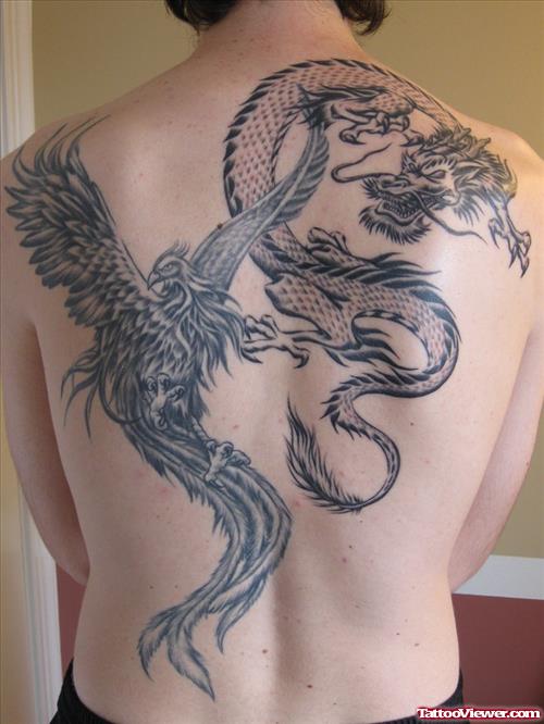 Grey Ink Dragon And Phoenix Tattoo On Back