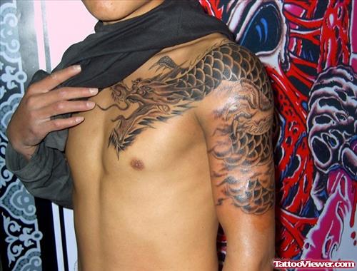 Grey Ink Dragon Chest And Left Shoulder Tattoo
