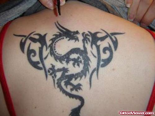 Black Ink Tribal Dragon Tattoo On Upperback