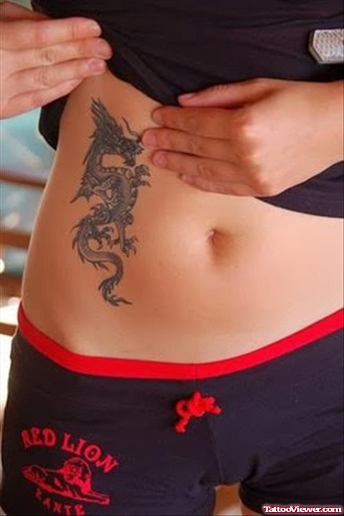 Girl Showing Her Hip Dragon Tattoo
