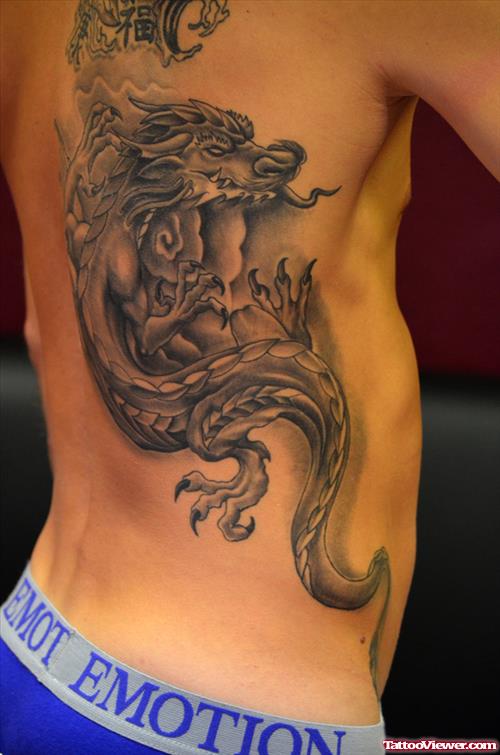 Grey Ink Dragon Tattoo On Man Side Rib