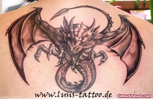 Attractive Grey Ink Dragon Tattoo On Upperback
