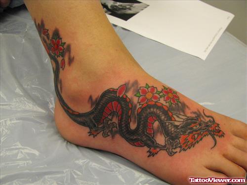 Japanese Flowers And Dragon Tattoo On Right Foot