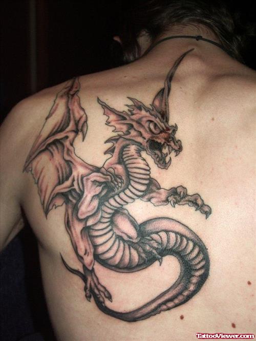 Grey Ink Dragon Tattoo On Left Back Shoulder