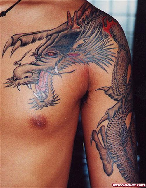 Attractive Grey Ink Dragon Tattoo On Man Left Shoulder