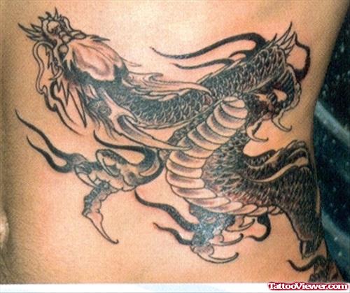Grey Ink Dragon Tattoo On Lowerback
