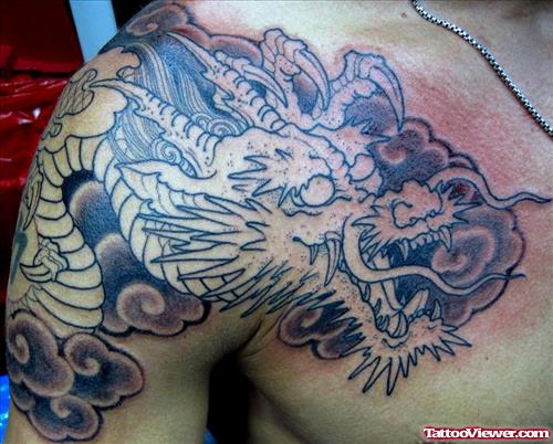 Beautiful Grey Ink Dragon Head Tattoo On Man Chest