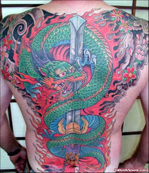 Awesome Colored Dragon And Dagger Tattoo On Back Body