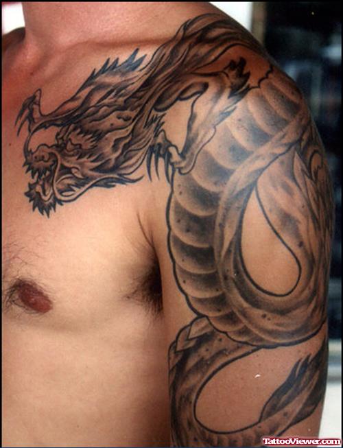 Cool Grey Ink Dragon Tattoo On Man Left Shoulder