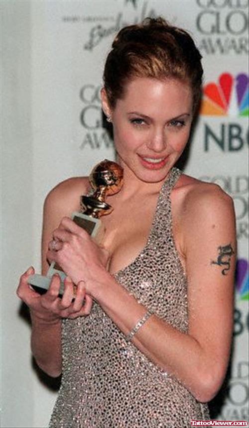 Angelina Jolie Dragon Tattoo On Left Bicep